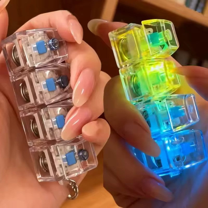 Mechanical Keyboard Fidget Toy held in hand showing compact portable design
